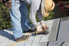 home_roof_construction_site_removal_of_old_roof_and_cg6p9263281c_th